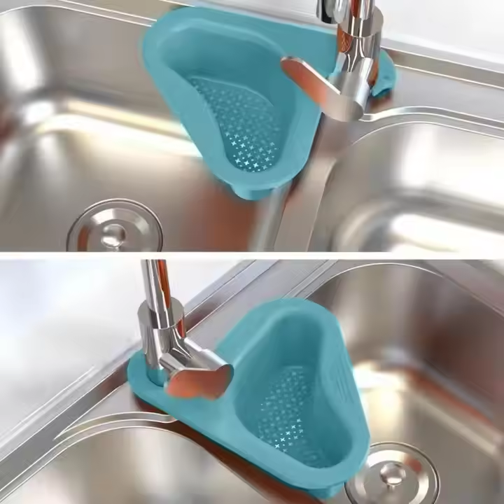 Blue corner drain basket hooked around a kitchen tap