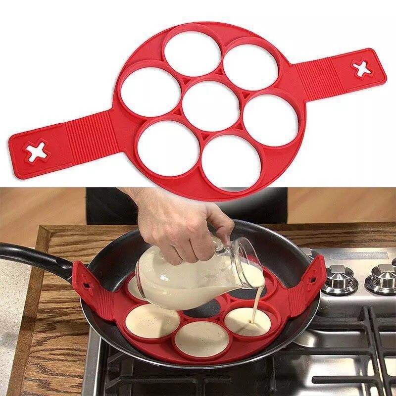 Flip n Cook seven-hole silicone pancake and egg mould shown in a frying pan